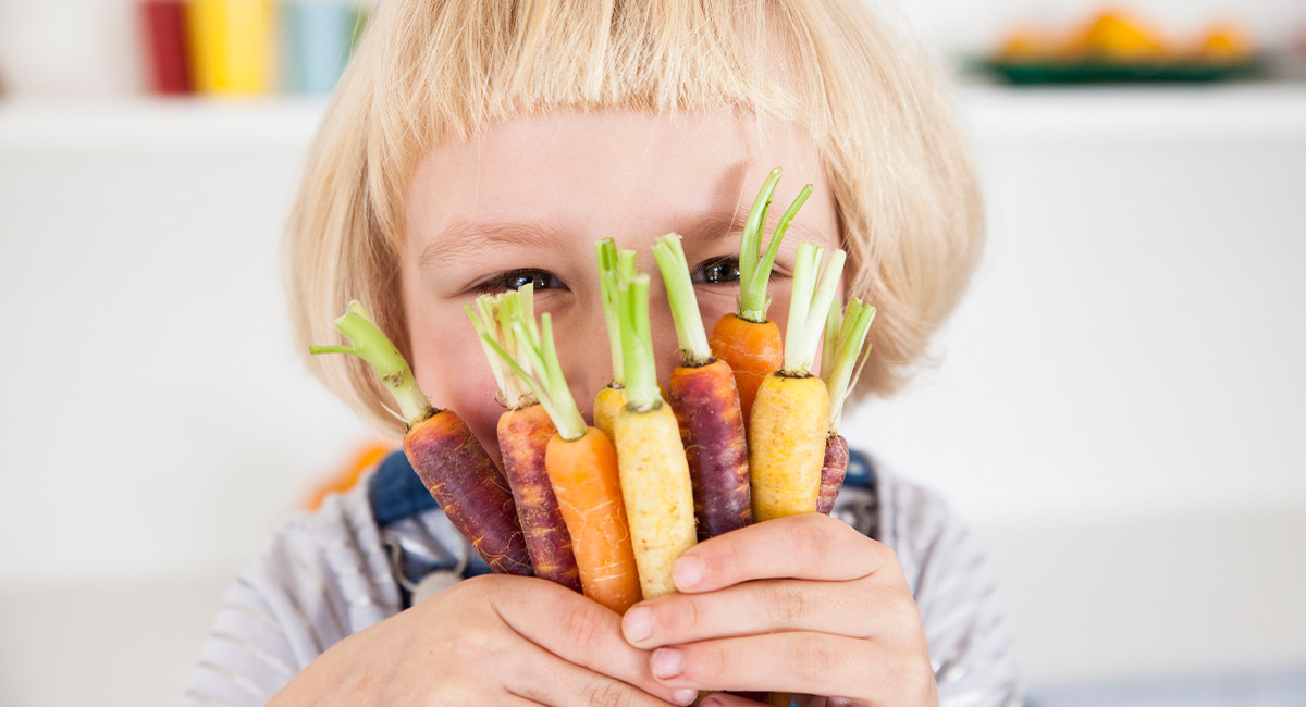 Child holding carrots