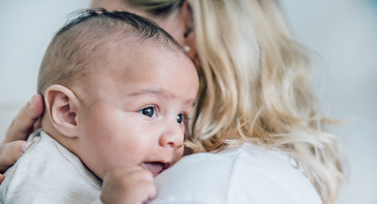 Baby on mother's shoulder
