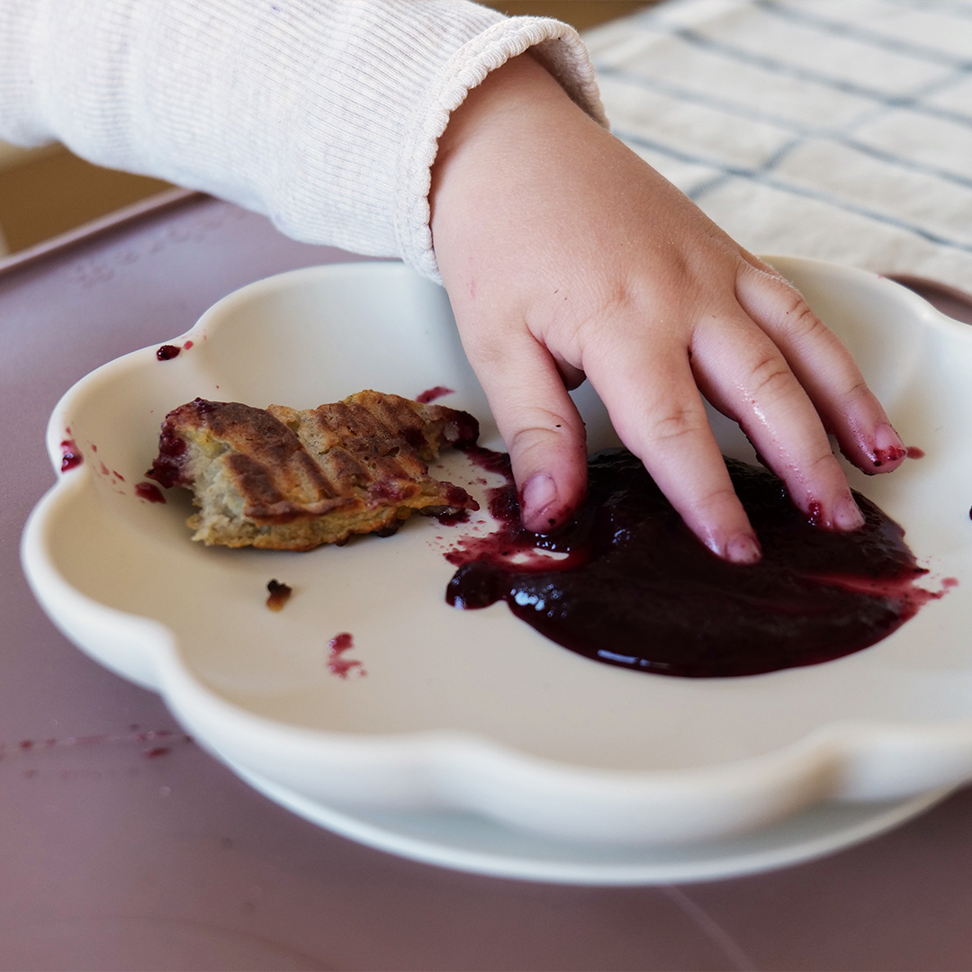 Baby's hand in puree