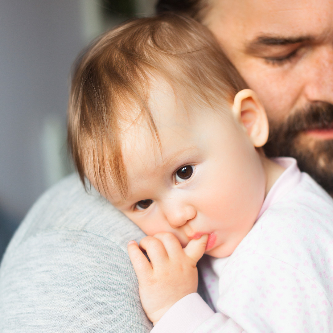 Baby and father cuddling